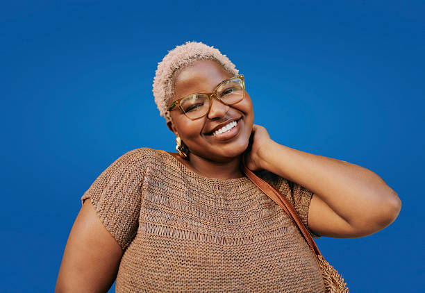 istock Young Creative African American Woman Smiling Outdoors With Blue Background 2244510746
