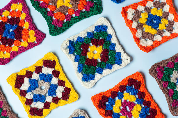 This image showcases a vibrant collection of crocheted cup mats, highlighted by a range of colors and patterns, perfect for showcasing handmade craftsmanship and artistic creativity.