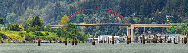 The Sauvie Island Bridge name changed to Wapato Bridge in November 2023. Wapato Bridge crosses the Multnomah Channel near Portland, Oregon. Sauvie Island is about 10 miles from Portland city center. The island has the Columbia River to the east, the Multnomah Channel to the west, and the Willamette River on the south. This is the only bridge to the island and comes off US 30. This island is a very popular tourist destination and has historic significance. Taken from a kayak on the Multnomah Channel. Multiple images merged together to make Panoramic.