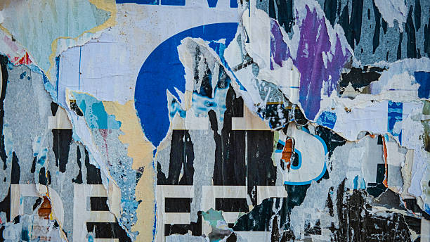istock Old ripped torn posters texture background in city street 2244521084
