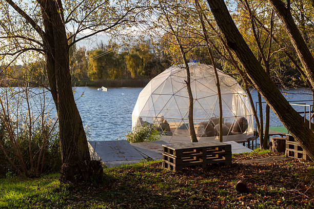 istock A transparent dome structure for relaxation on the river bank on a sunny autumn day 2244523300