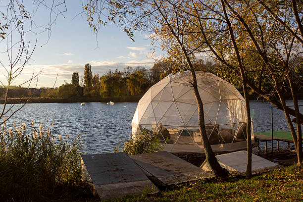 istock A transparent dome structure for relaxation on the river bank on a sunny autumn day 2244523317