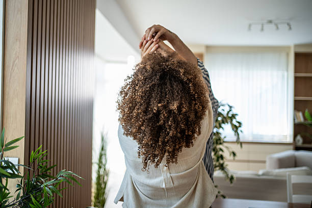 istock Woman stretching her arms enjoying a relaxing morning 2244532840