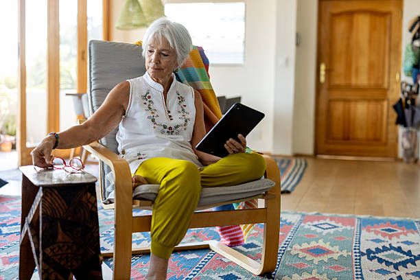istock Senior woman communicating with friends online 2244535234
