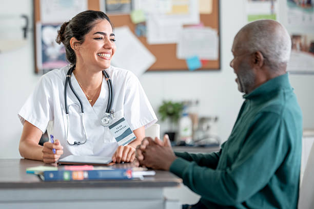 istock Hispanic Female Nurse With Stethoscope Interacting With Elderly Patient At Clinic 2244535496