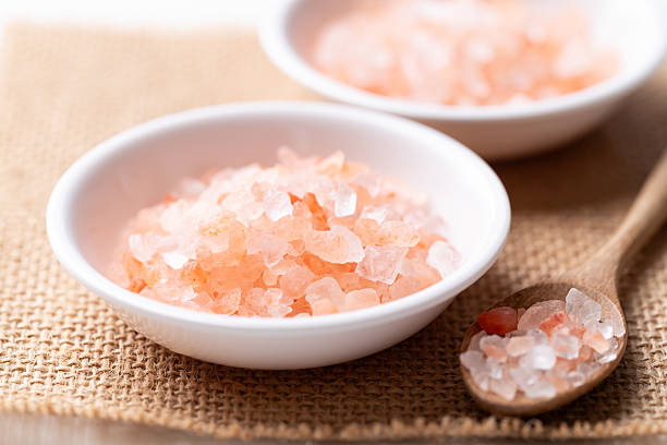 istock Himalayan pink salt in bowl with spoon 2244547447