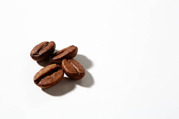 istock Cup of coffee with grains on white background 2244547970