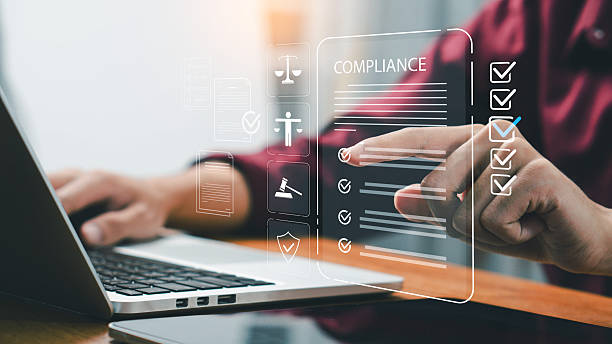 istock A businessman using digital devices to manage compliance documents and checklist icons, representing corporate governance, legal standards, data protection, and business regulation in modern technology. 2244553822