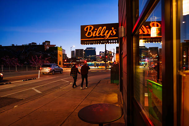 RiNo Disctrict, downtown Denver, Colorado. Urban scene during blue hour outside Billy's restaurant with city skyline in background. October 29, 2025.