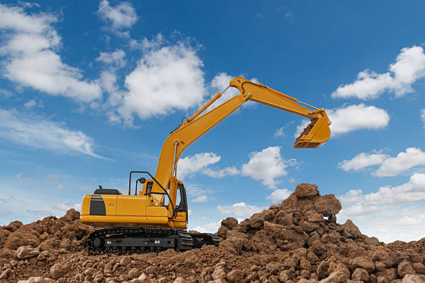 istock Excavator with bucket lift up  are digging  soil . 2244558321