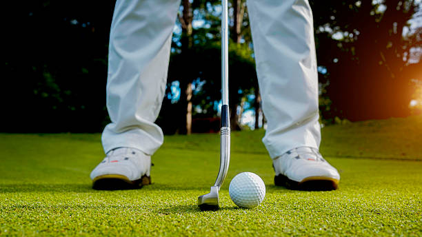 istock Golfers are putting golf in the evening golf course golf backglound. 2244558956