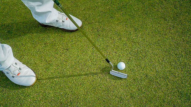 istock Golfers are putting golf in the evening golf course golf backglound. 2244558991