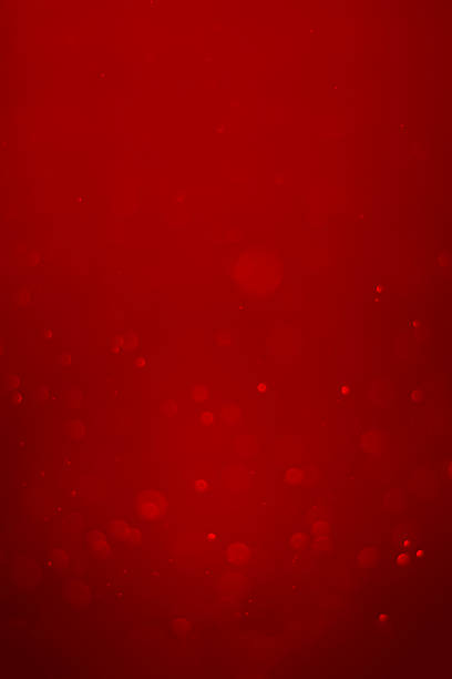 blurred red glitter vintage lights background.  Red bokeh shiny on dark background. Vertical photos