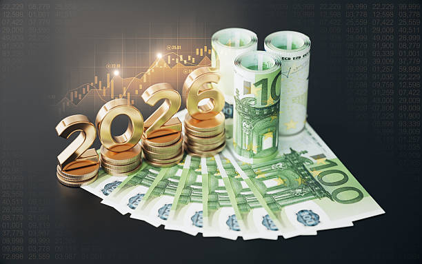 istock Gold Colored 2026 Text and Coin Stack with 100 Euro Banknotes, Financial Bar Graph on Black Background. 2244560695
