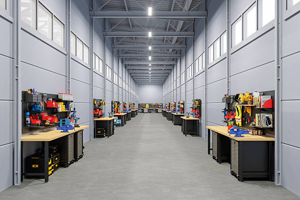 Modern industrial workshop with organized workbenches and tools in a spacious warehouse