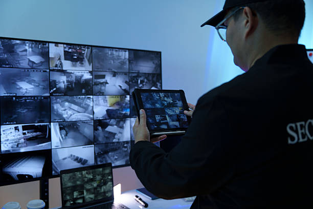istock Security officers are checking the TV screen of the CCTV system. 2244561663