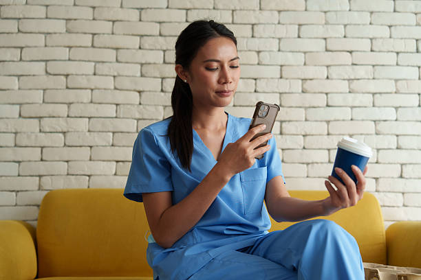 istock Doctors are taking selfies while drinking coffee and relaxing while waiting to examine patients in the hospital. 2244561833