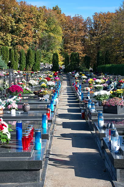 istock Cemetery decorated with flowers and candles 2244563712