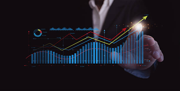 istock Business growth and data analytics concept. A businessman touches a virtual financial chart with rising bars and trend lines, symbolizing success, profit, technology, and digital performance improvement. 2244565212