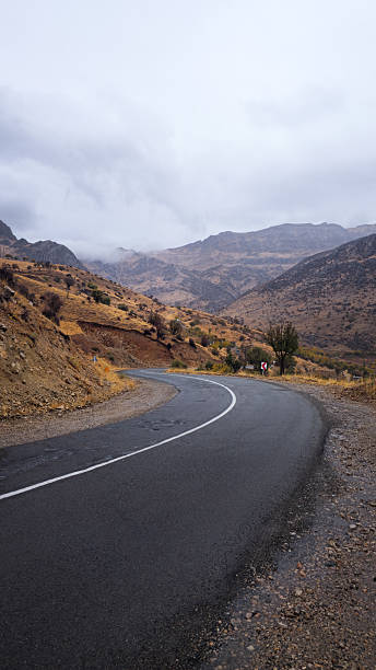 istock Rainy Autumn Mountain Road 2244566711
