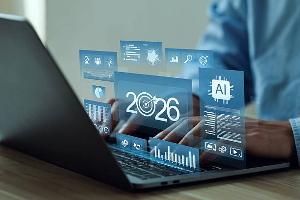 istock Hands typing on a laptop with holographic dashboards showing 2026, target icon, AI chip, charts, and KPIs, visualizing business goals, strategy, forecasting, and a data-driven 2026 business plan. 2244567563