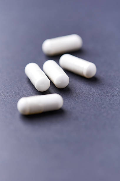 istock HMB capsules on dark background. Soft focus. Close up. Copy space. 2244568043