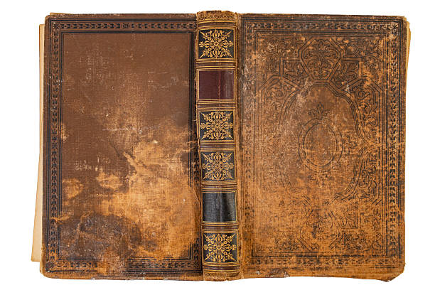 istock Empty vintage book hard cover face down, front and back stained texture isolated on white 2244569004