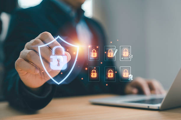istock Businessman touching digital shield icon with padlock symbol representing data protection privacy security information safety and cyber defense technology for modern business. 2244570026