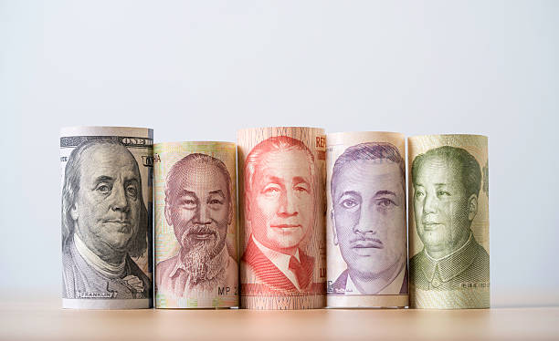 istock Rolled paper currencies from different countries representing currency exchange forex trade global finance investment and international economic market concept for business growth. 2244570081