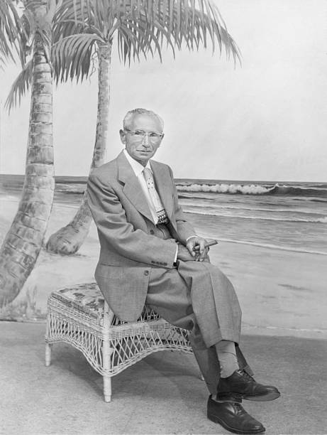istock Elderly Man in Suit by Beach Backdrop 2244571054