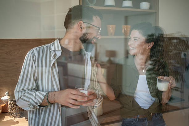 istock Happy couple enjoying morning milk in kitchen 2244571328