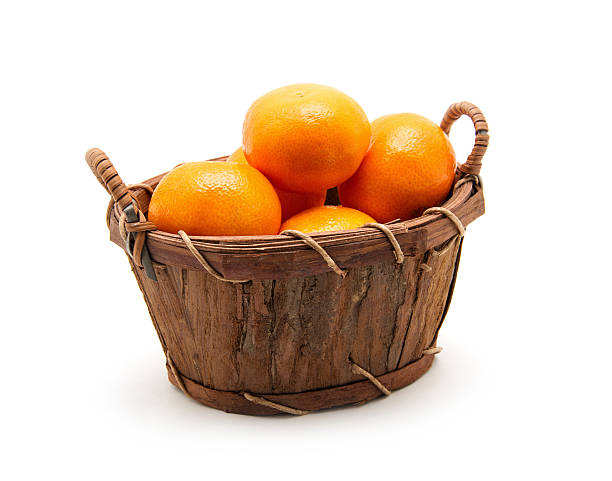 istock Mandarin in basket isolated on white 2244572871