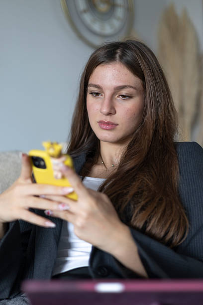 istock Woman using smartphone for communication, focused on social media or business 2244574132