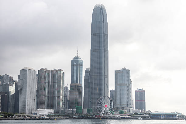 11 April 2025, Hong Kong.Hong Kong’s iconic skyline rises dramatically with its dense cluster of skyscrapers set against the surrounding hills. A faint haze lingers over the city, hinting at the ongoing challenge of air pollution that often softens the otherwise sharp urban vista.