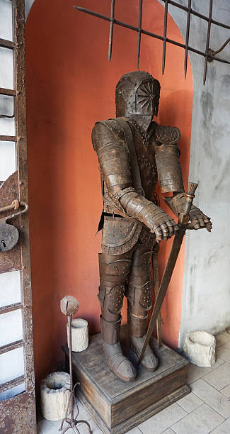 Valletta, Malta - September 23, 2025: Medieval knight statue in armor stand outside a building at Valletta, Malta on September 23, 2025.