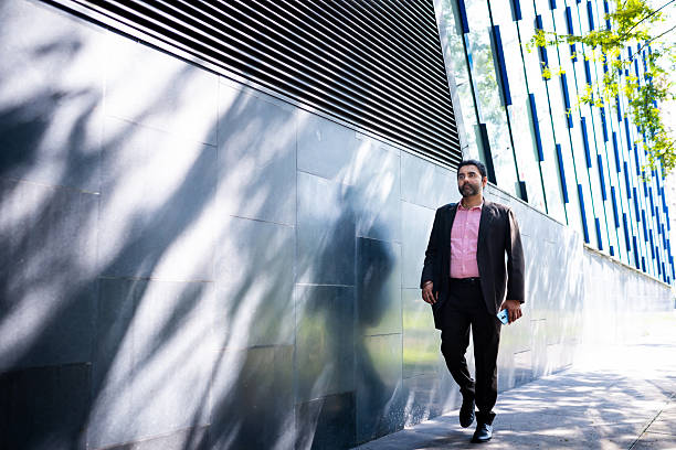 istock Sikh businessman walking at downtown district 2244578034