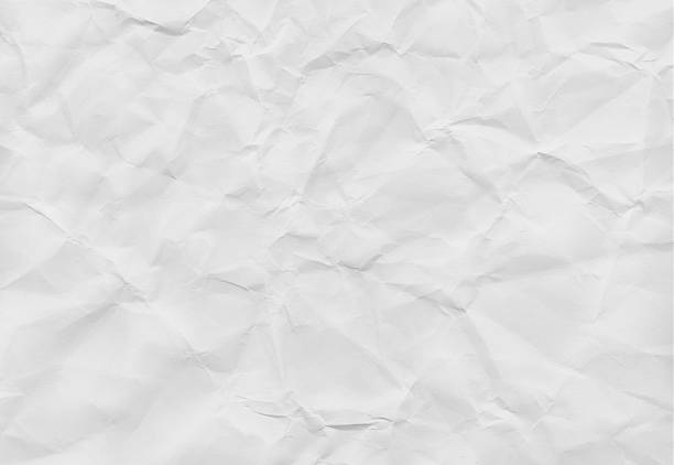 istock Crumpled white paper texture with soft shadows, ideal for backgrounds or design elements 2244582962