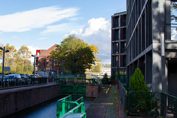 istock Buildings and greenery along a canal in an urban setting during autumn 2244585763
