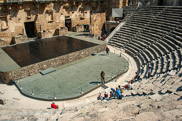 Antalya, Türkiye - September 03, 2019:  People sitting in the ancient theater of Aspendos