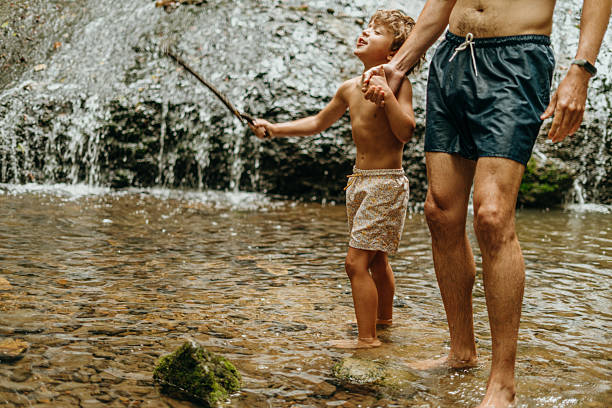 Father and son in the river