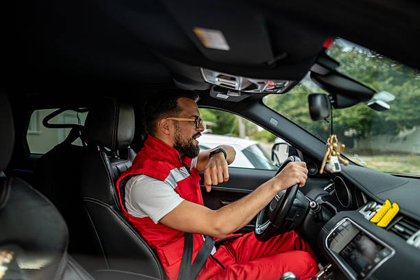 istock Male paramedic driving emergency vehicle in uniform 2244592696