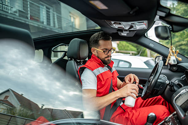 istock Paramedic man in car drinking water from bottle 2244592964