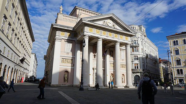 Trieste, Italy - September 29, 2025: People going near Exchange building in Trieste, Italy. Palazzo della Borsa Vecchia. BORSA VECCHIA Trieste