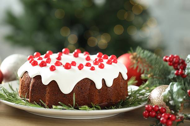 istock Traditional classic Christmas cake and decor on wooden table 2244603470