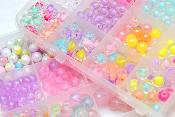 istock Storage box with colorful beads close up view 2244605786