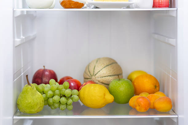 istock Fresh fruits on refrigerator shelf creating healthy eating concept 2244608005