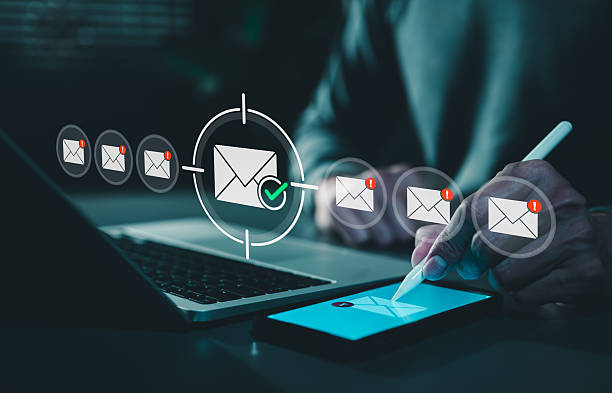 istock Email security and spam protection concept. Person using smartphone with icons of verified mail and warning envelopes, represent secure communication, inbox management, cybersecurity, e-mail filtering 2244608162