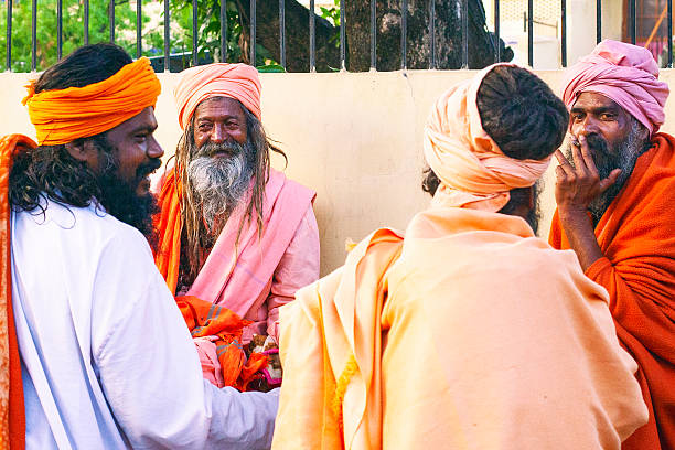 Rishikesh, Uttarakhand ,  India - December 1, 2019 : Indian hindu devotee monks(sadhu) around famous Swarg Ashram  in pilgrimage tourist spot Rishikesh
