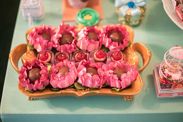 Sweets and decoration on the table - Children's birthday garden theme