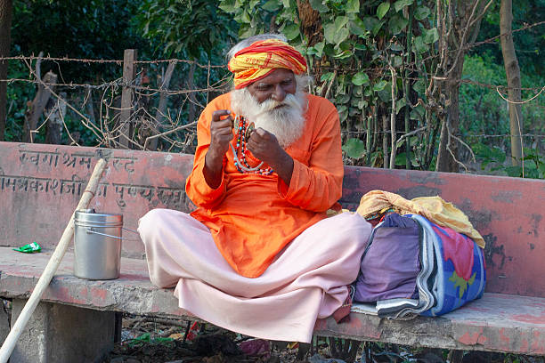Rishikesh, Uttarakhand, India - December 1, 2019 : Indian hindu devotee monks(sadhu) around famous Swarg Ashram  in pilgrimage tourist spot Rishikesh